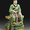A large and imposing sancai stoneware figure of a <b>Daoist</b> deity, Ming dynasty