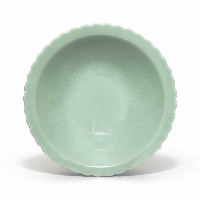 A celadon-glazed incised floral bowl, Qianlong six-character seal mark in underglaze and of the period (1736-1795)