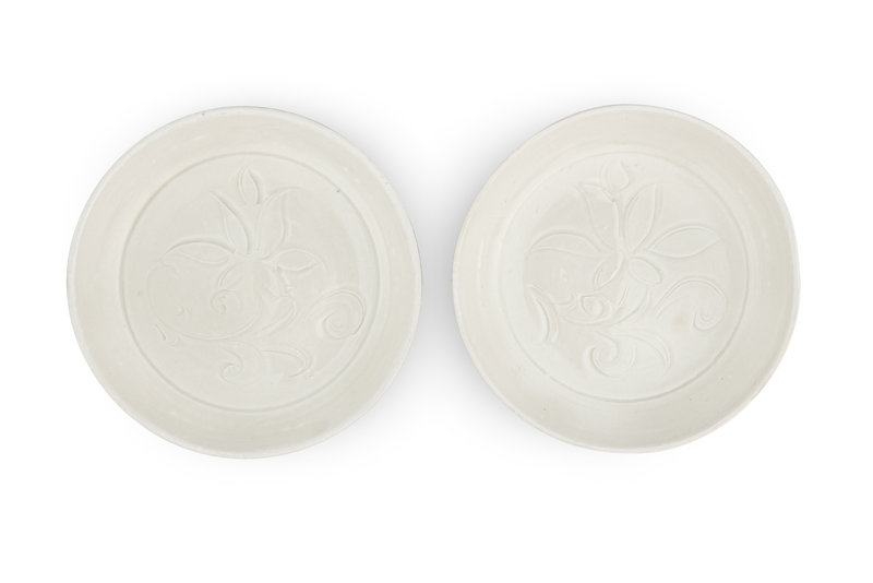 A pair of carved 'Ding' 'lotus' dishes, Northern Song dynasty