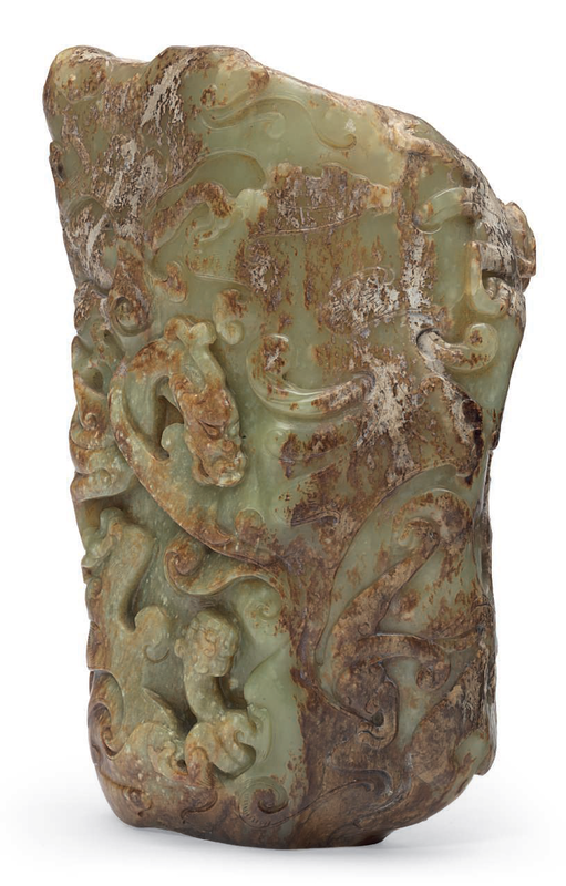 A large yellowish-green and brown jade archaistic vessel, Ming-early Qing dynasty, 14th-17th century