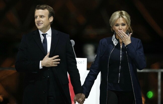 648x415_french-president-elect-emmanuel-macron-holds-hands-with-his-wife-brigitte-during-a-victory
