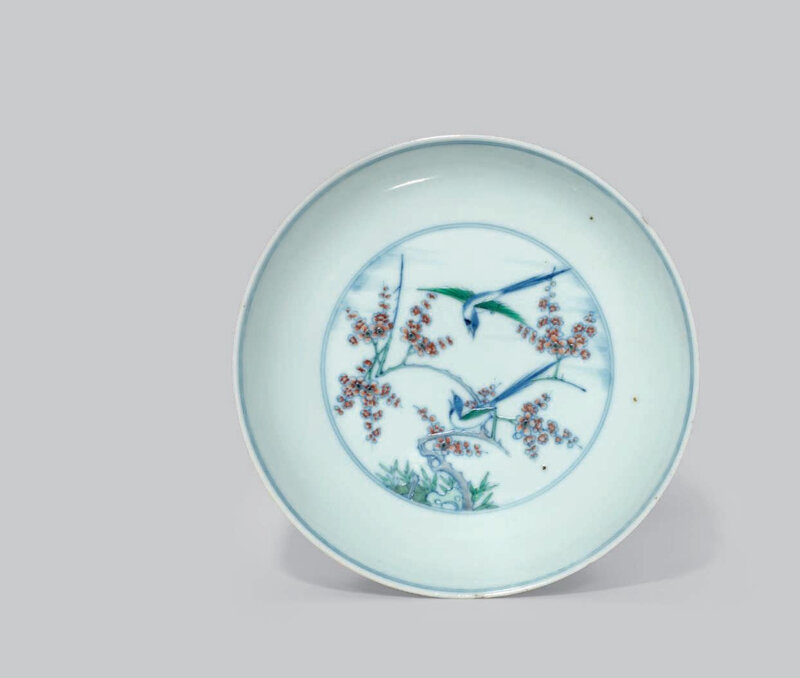 A doucai 'magpie and prunus' dish, Kangxi six-character mark in underglaze blue within a double circle and of the period (1662-1722)