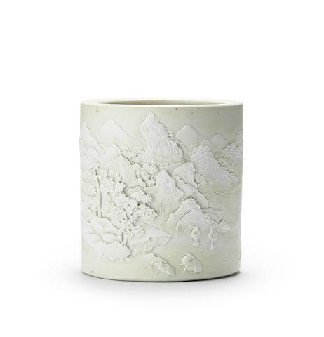 A very rare carved biscuit porcelain brushpot, bitong, Daoguang seal mark and of the period (1821-1850)