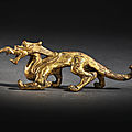 An exceptionally rare gilt-bronze dragon, Six Dynasties (221-559)