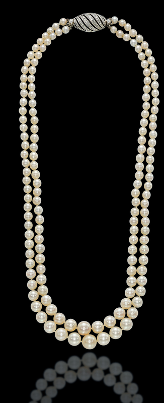 A two-strand natural pearl and diamond necklace