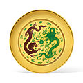 A yellow-ground <b>aubergine</b> <b>and</b> <b>green</b> enamelled 'Dragon' dish, Qianlong six-character seal mark in <b>aubergine</b> enamel <b>and</b> of the 