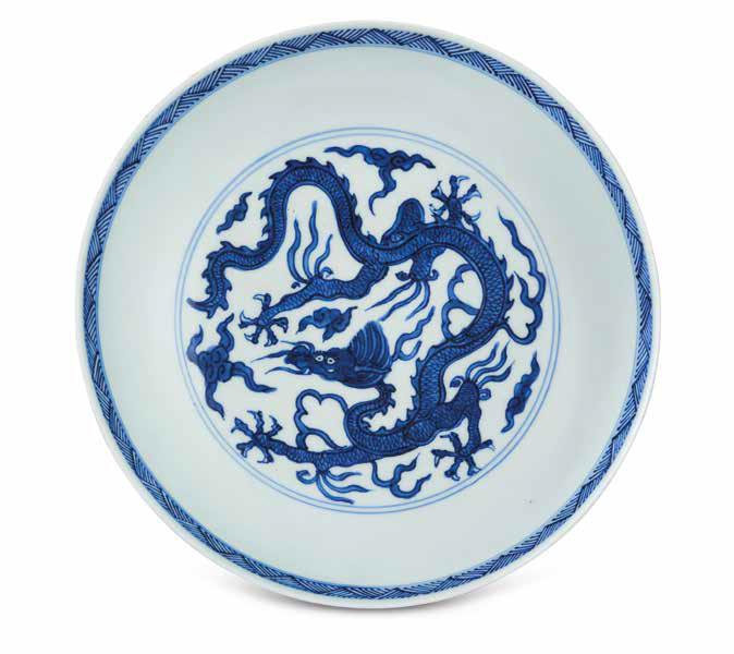 An Incised Blue And White ‘Dragon’ dish, Wanli Six-Character Mark In Underglaze Blue Within A Double Circle And Of The Period (1573-1619)