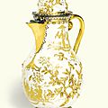 A Meissen Hausmaler coffee pot and hinged cover, circa 1725, with German silver-gilt mounts, probably Paul Solanier, Augsburg