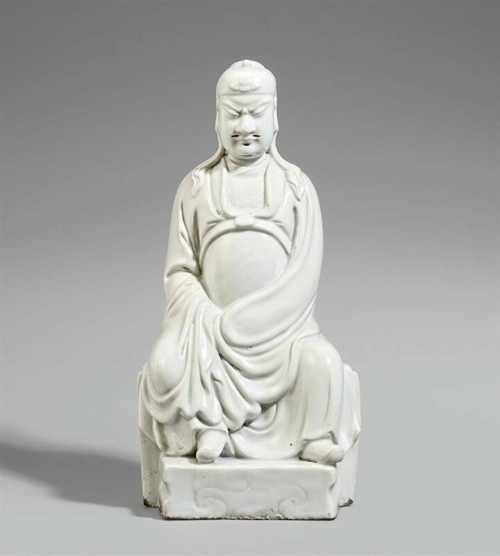 A blanc de Chine figure of a seated Guandi