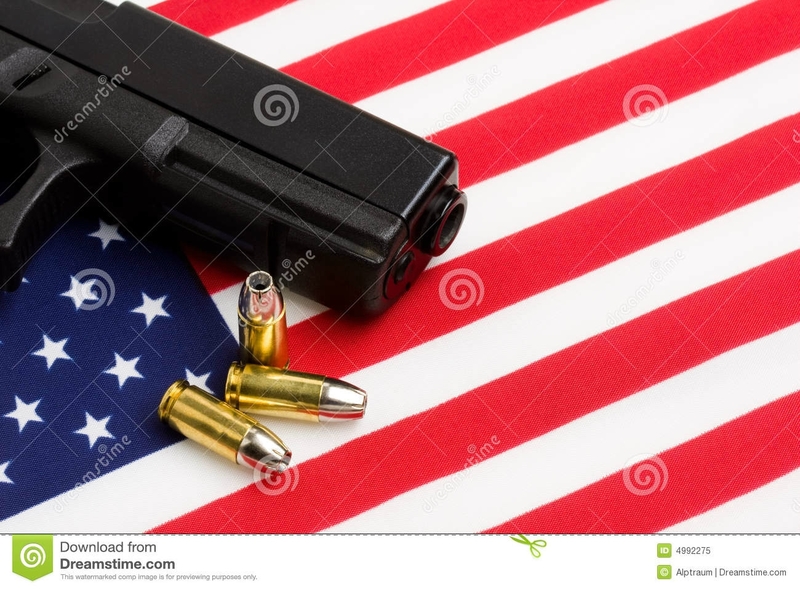 gun-over-american-flag-4992275