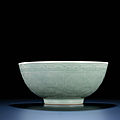 A large moulded celadon-glazed bowl, <b>Qianlong</b> <b>six</b>-<b>character</b> <b>sealmark</b> <b>and</b> <b>of</b> <b>the</b> <b>period</b> (1736-1795)