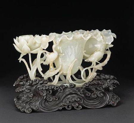 A_carved_white_jade_lotus_and_bird_group