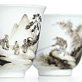 A rare pair of <b>grisaille</b>-decorated 'figure in landscape' cups, marks and period of Yongzheng (1723-1735)