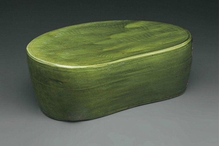 A large Cizhou-type green-glazed pillow, China, Song-Jin Dynasty, 11th-12th century