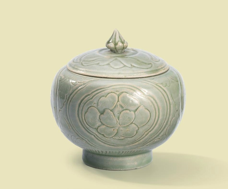 A carved Yue 'Peony' jar and cover, Northern Song dynasty (960-1127)