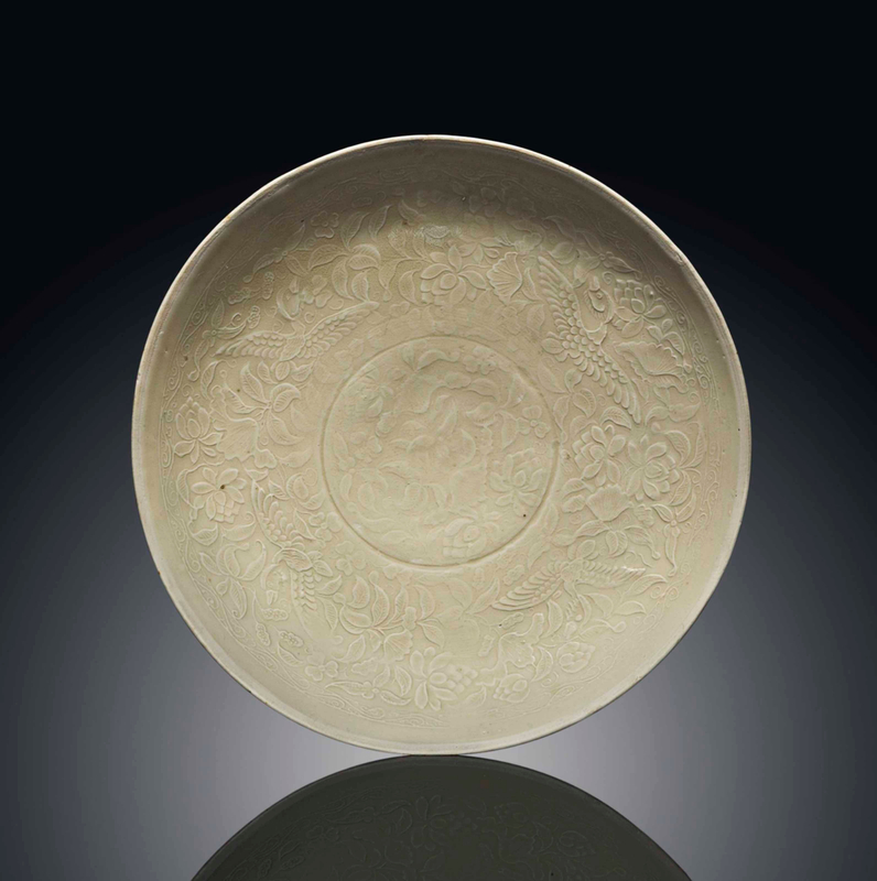 A finely moulded Dingyao dish, Jin dynasty (1115-1234)