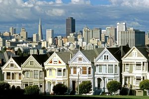 san-francisco-landscape-picture-of-classic-multi-colored-duplex-homes-and-downtown-high-rise-buildings