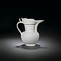 A rare inscribed white '<b>monk</b>'s cap' ewer, Yongle period (1403-1424)