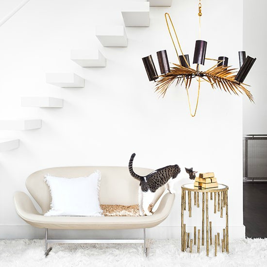 White-living-room-with-bronze-chandelier