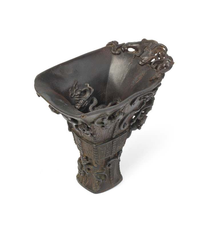 A rare and large rhinoceros horn archaistic 'sixteen-dragon' libation cup, 18th century