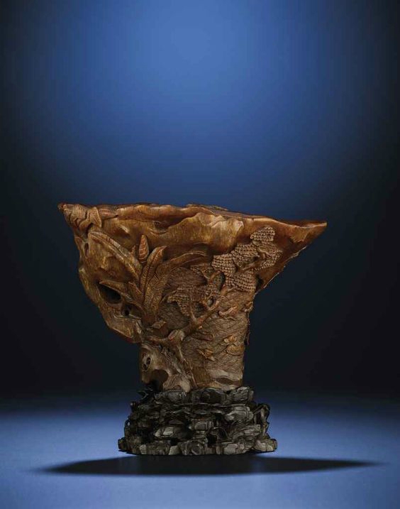 A finely carved 'Pavilion' rhinoceros horn libation cup, Ming dynasty, early 17th century 