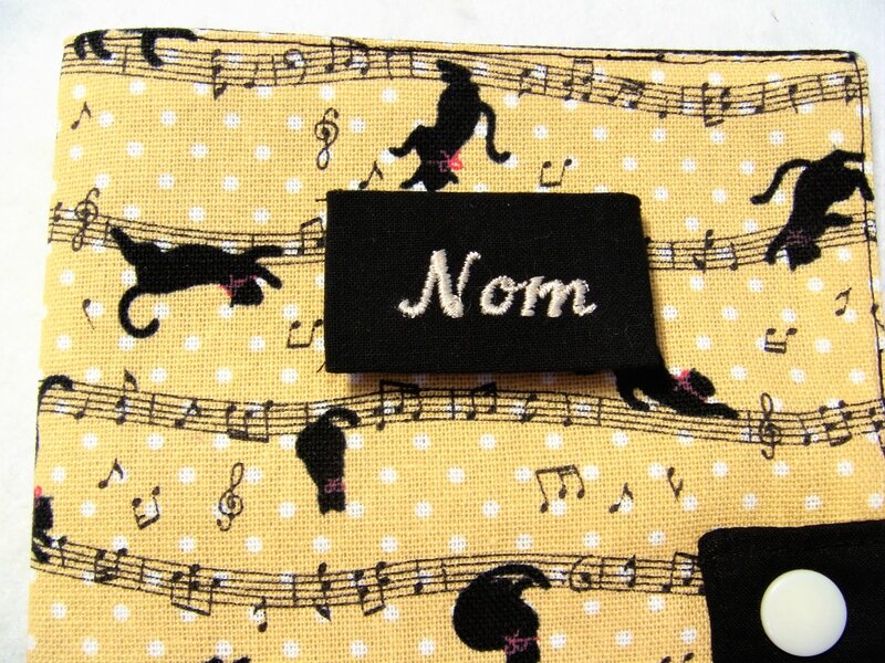 Protège carnet chats noir notes musique zoom