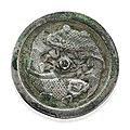 A silvery bronze <b>circular</b> <b>mirror</b> with two carps. Jin dynasty (1115-1234)