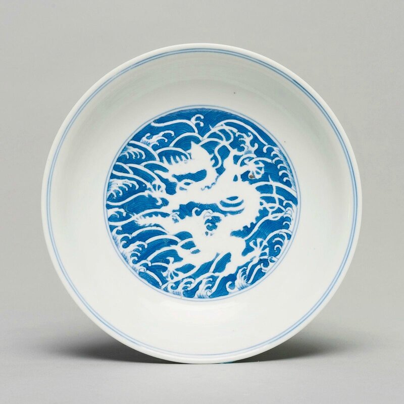 A blue and white reverse-decorated 'dragon' dish, Daoguang seal mark and period