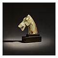 An extremely important and rare celadon and russet jade horse head, Han–Six Dynasties