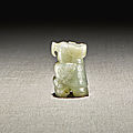 A <b>celadon</b> <b>and</b> <b>russet</b> <b>jade</b> figure of an owl, Shang dynasty