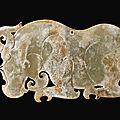 A rare archaic jade 'rhinoceros' plaque, <b>Eastern</b> <b>Zhou</b> <b>dynasty</b> (770-221 BC)