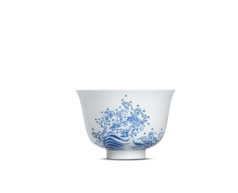 A fine and very rare blue and white ‘wave’ cup, Kangxi six-character mark in underglaze blue within a double circle and of the period (1662-1722)