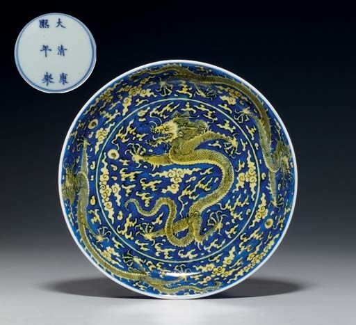A_fine_yellow_and_blue__Dragon__dish__Kangxi_six_character_mark_in_underglaze_blue_within_a_double_circle_and_of_the_period__1662_1722_
