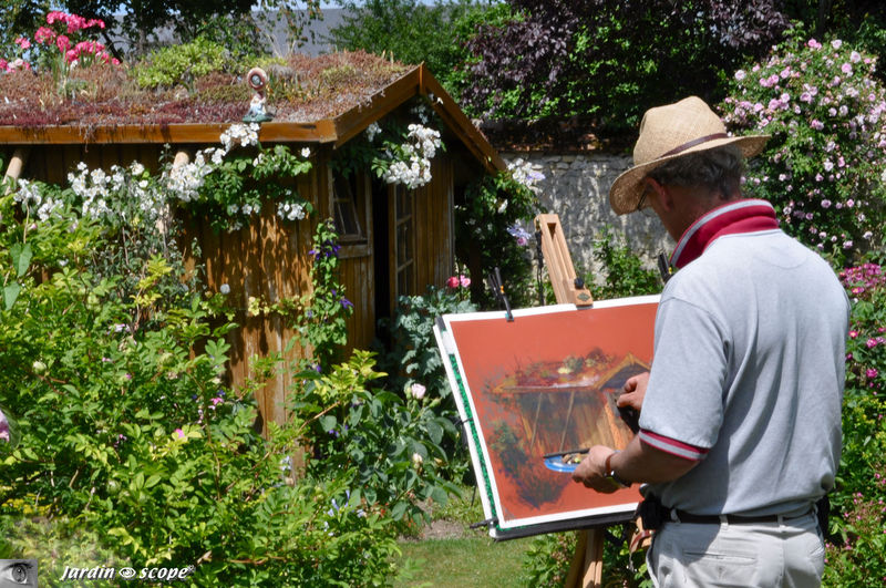 Aquarelliste s'adonnant à son art dans le jardin d'André