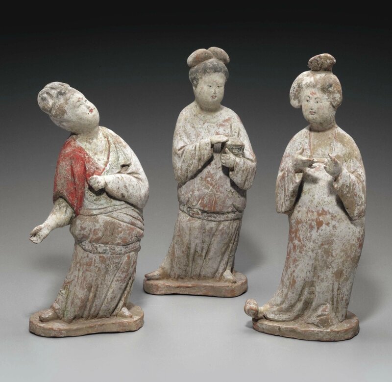 An unusual group of three painted pottery figures of court ladies, Tang dynasty (AD 618-907)