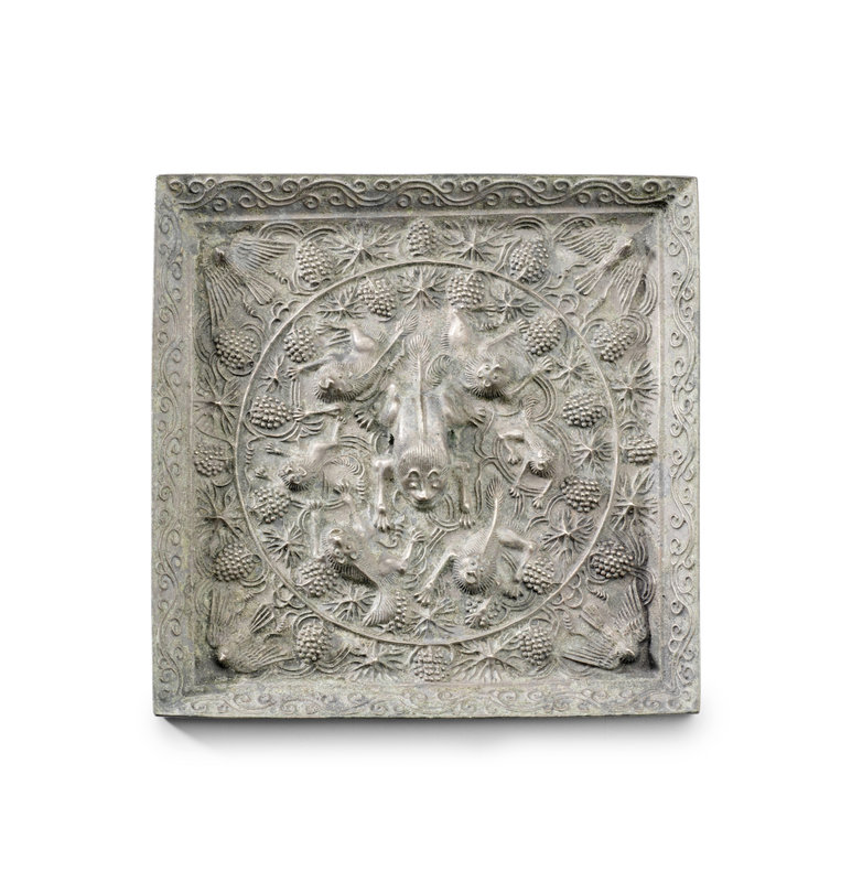 A rare large silvered-bronze square 'lion and grapevine' mirror, Tang Dynasty, 7th-8th Century