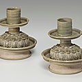 A rare pair of greyish-green-glazed stoneware lamps, Sui-Tang dynasty, <b>6th</b>-<b>7th</b> <b>century</b>