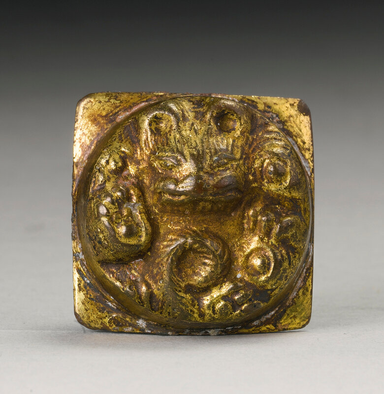 A gilt-bronze 'Tiger' fitting, Han dynasty (206 BC-220 AD)