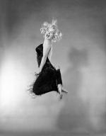 1959-10-NY-Jump_sitting-black_dress-by_halsman-015-2