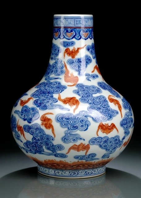 A blue and white and iron-red decorated bat and cloud vase, underglaze blue Guangxu mark and period (1875-1908)