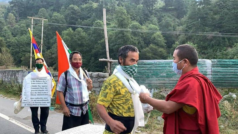 The-three-activists-being-felicitated-by-a-monk-at-the-beginning-of-the-Peace-March-on-Wednesday-Phayul-photo