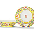 A pair of <b>yellow</b>-<b>ground</b> <b>famille</b> <b>rose</b> 'Wan nian jia zi' saucer dishes, Iron-red Jiaqing seal marks and of the period 