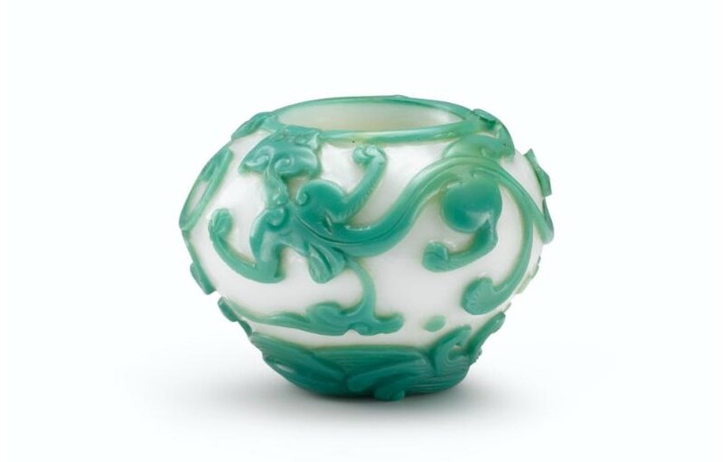 A rare imperial green-overlay white glass ‘mythical beast’ waterpot, Incised mark and period of Qianlong (1736-1795)