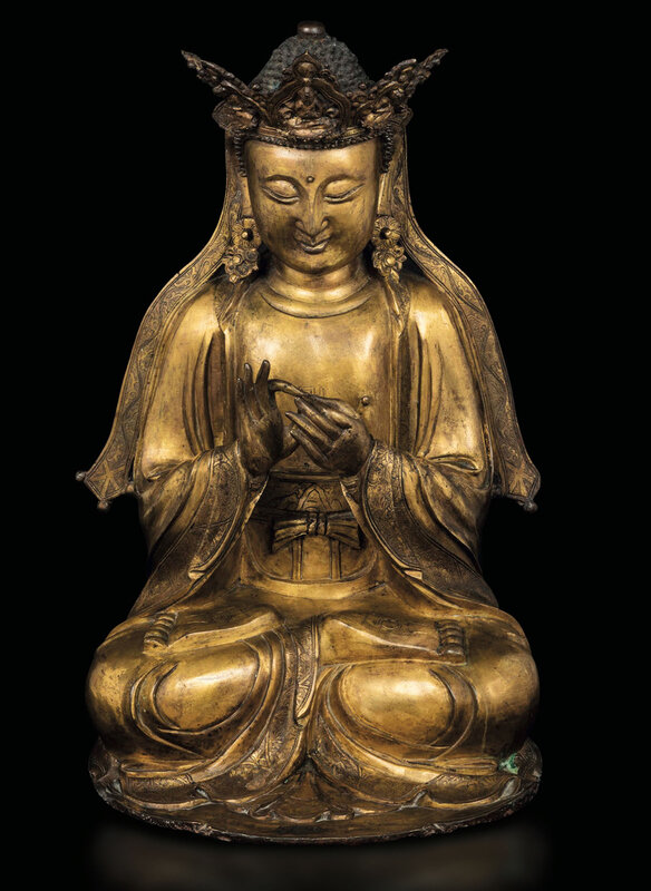 A gilt bronze figure of Vairocana, China, Ming Dynasty, 16th century