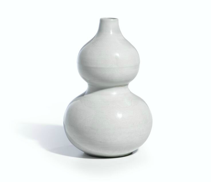 A White Anhua Lotus Double-Gourd Vase, Ming Dynasty, 16th Century