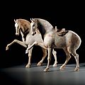 A pair of painted pottery figures of <b>prancing</b> <b>horses</b>, Tang dynasty (618-907) 