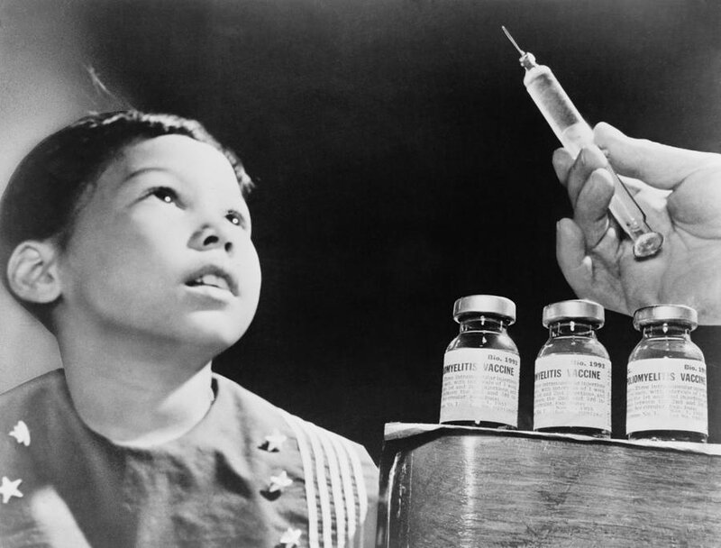 Child Looks At A Syringe is a photograph by Everett