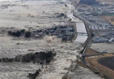 1623911079_earthquake_triggered_tsunami_waves_sweep_along_iwanuma_in_northern_japan