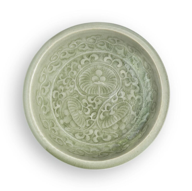 A carved 'Yaozhou' celadon dish, Yuan-Early Ming dynasty