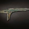 An exceptionally rare and important archaic bronze ceremonial <b>halberd</b> blade (ge), Eastern Zhou dynasty, early Spring and Autumn 